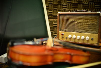 Close-up of violin and radio 