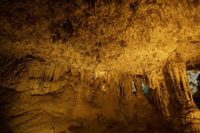 Low angle view of illuminated rock formation at night