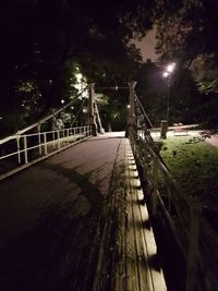 View of illuminated street lights at night