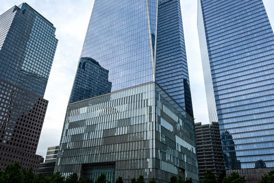 Low angle view of modern buildings in city against sky