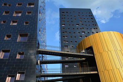 Low angle view of modern buildings against sky in city