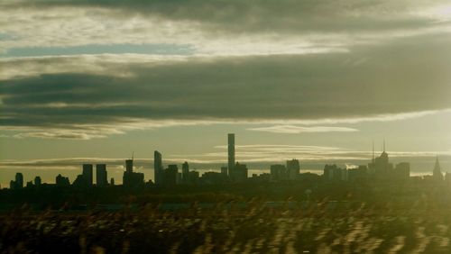 Panoramic view of cityscape against sky during sunset