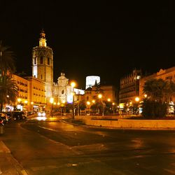 Illuminated buildings in city at night