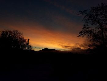 Scenic view of silhouette landscape against sky during sunset