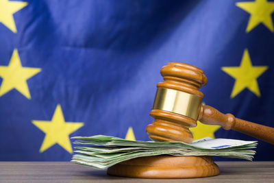 Close-up of yellow flag on table