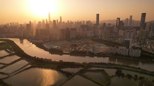 High angle view of city at sunset