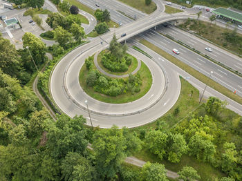 High angle view of elevated roads by trees in city
