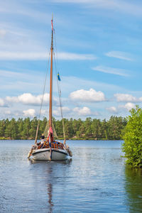 Sailboat on a forest lake