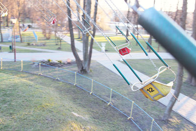 Close-up of railing against trees