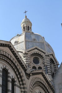 Low angle view of church against blue sky