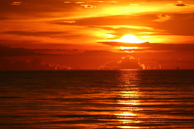 Scenic view of sea against romantic sky at sunset