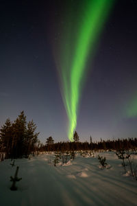 Scenic view of lake against sky at night