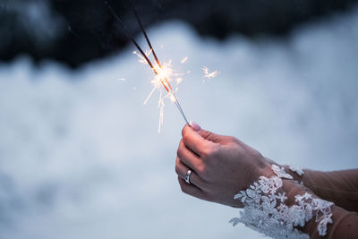 Woman holding sparklers