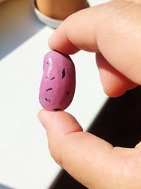 Close-up of human hand holding candy