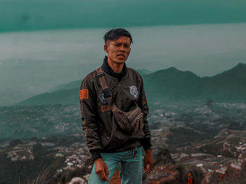 Full length of man standing on mountain