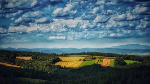 Scenic view of landscape against cloudy sky