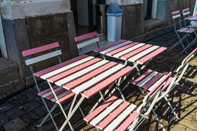 High angle view of empty chairs and tables in cafe