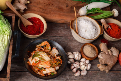 Fresh ingredients and vegetables placed in the table for making kimchi which contains ingredients