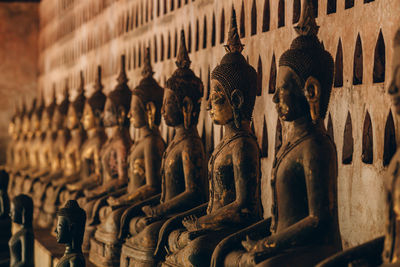 Statues in temple outside building