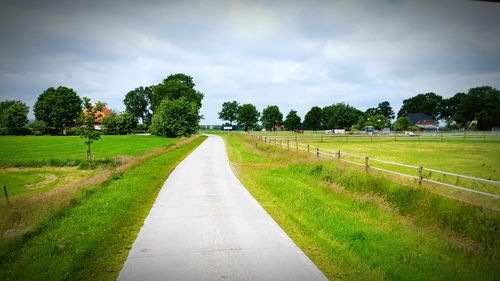 Road passing through field