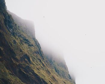 Low angle view of mountains against sky