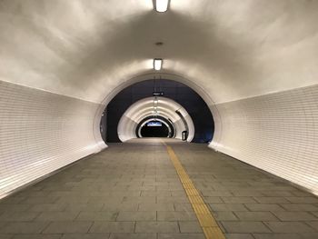 Interior of illuminated empty subway tunnel