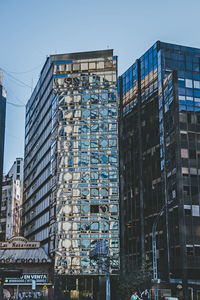 Low angle view of modern buildings against sky