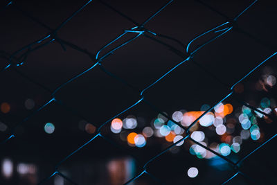 Close-up of illuminated chainlink fence