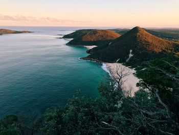 High angle view of sea against sky at sunset