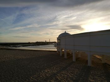 Scenic view of beach against sky during sunset