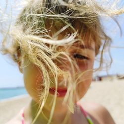 Close-up portrait of girl on beach