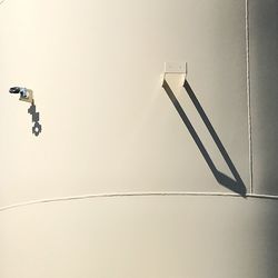 Low angle view of illuminated light against wall