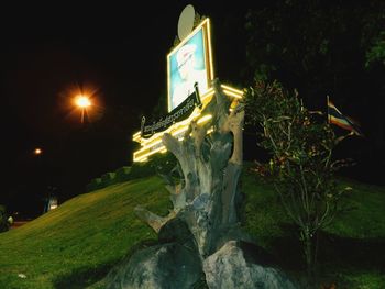 Low angle view of illuminated building at night