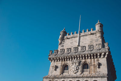 Low angle view of building against blue sky