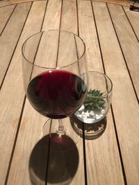 High angle view of wineglass on table