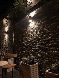 High angle view of illuminated restaurant by building at night