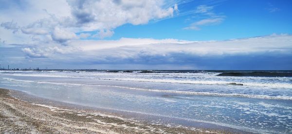 Scenic view of beach against sky