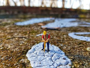 Close-up of stuffed toy on rock