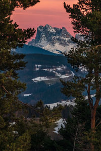 Scenic view of snowcapped mountains against sky during winter