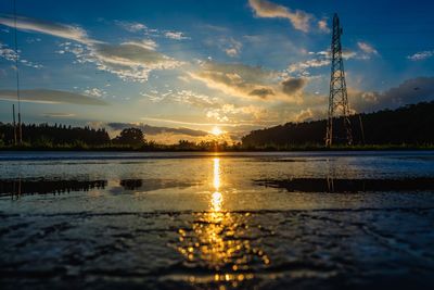 Scenic view of lake against sky during sunset