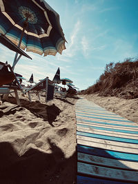 Built structure on beach against sky