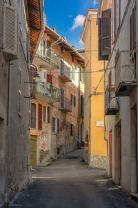 Narrow alley amidst buildings in town