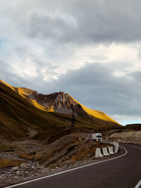 Scenic mountain road at sunset