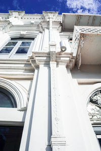 Low angle view of white building against sky