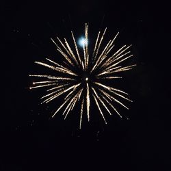 Low angle view of firework display at night