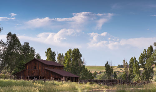 House on field against sky