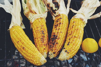 High angle view of corns on barbecue