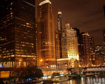 Illuminated buildings in city at night