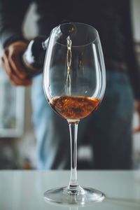 Close-up of wineglass on table