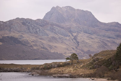 Scenic view of landscape and mountains against sky